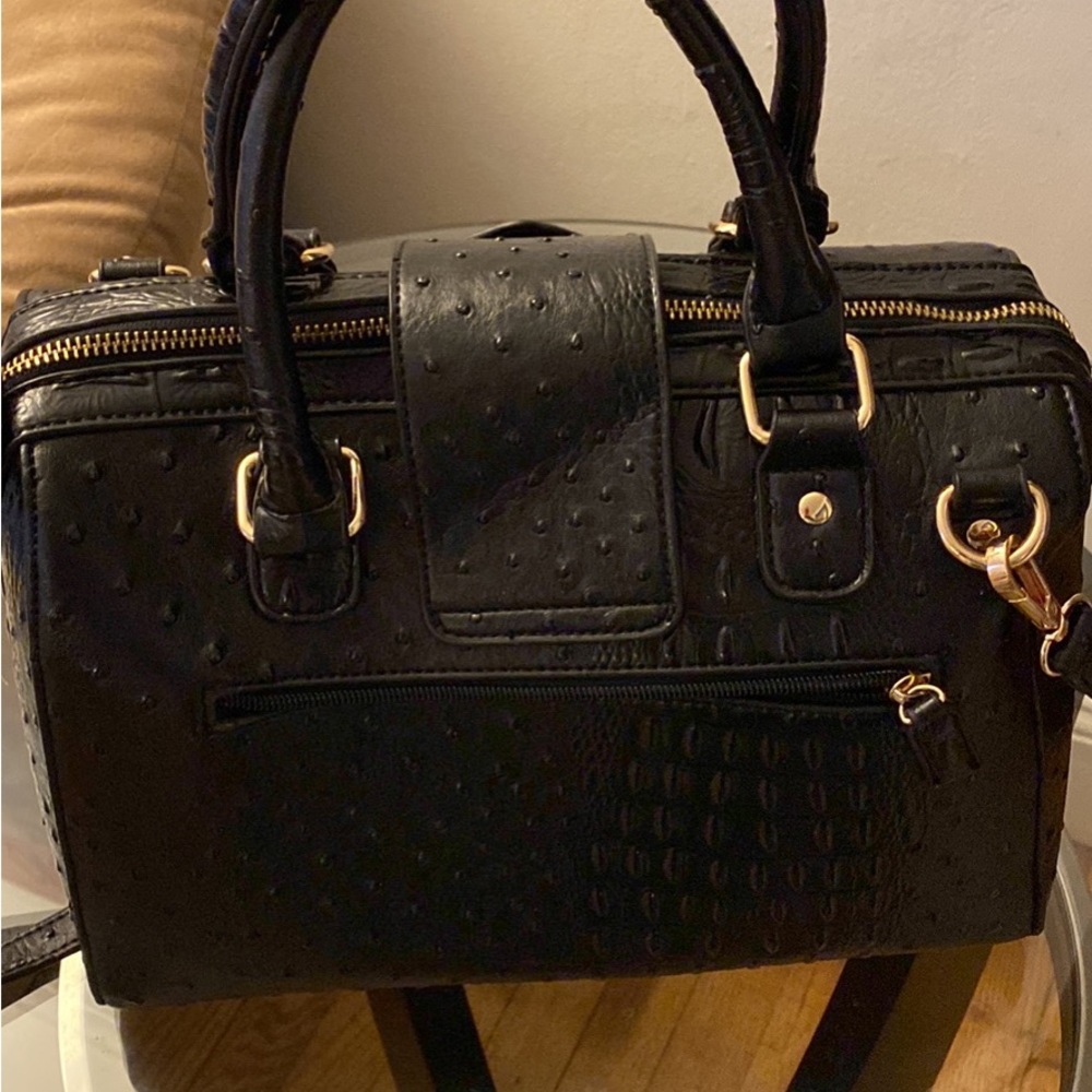 I am selling a large leather hand bag. Too big for me . Was used once
